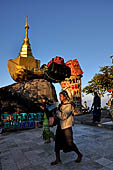 Myanmar - Kyaikhtiyo, porters carrying luggage's of the pilgrims. 